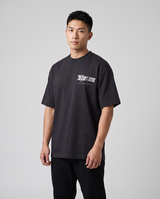 Black Sakurasheniru Blossom T-Shirt by KHROME AISUAUTO worn by a model, front view with chest logo
