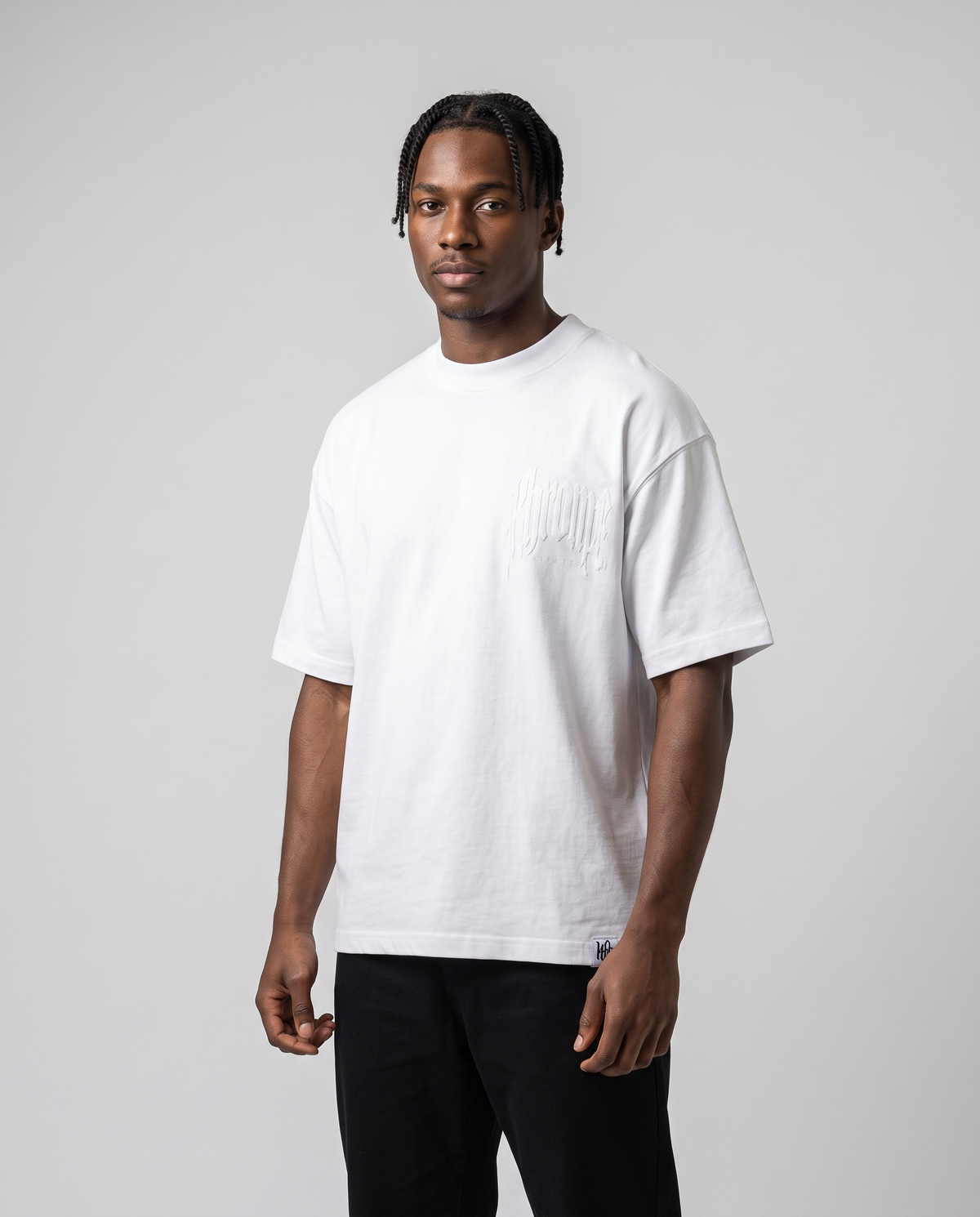 White Urban Street T-Shirt by KHROME AISUAUTO worn by a model, front view with chest logo