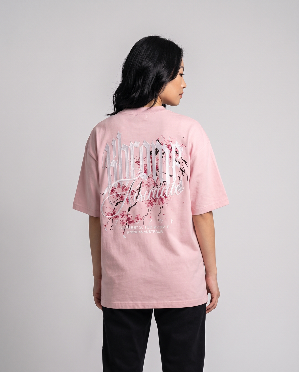 Pink Minimarisuto Sakura T-Shirt by KHROME AISUAUTO worn by a model, back view showing the full back print