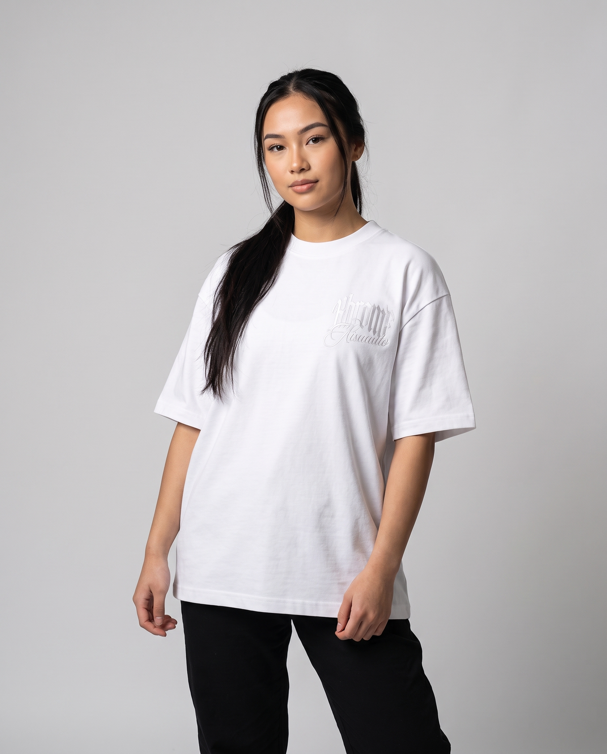 White Minimarisuto Sakura T-Shirt by KHROME AISUAUTO worn by a model, front view with chest logo
