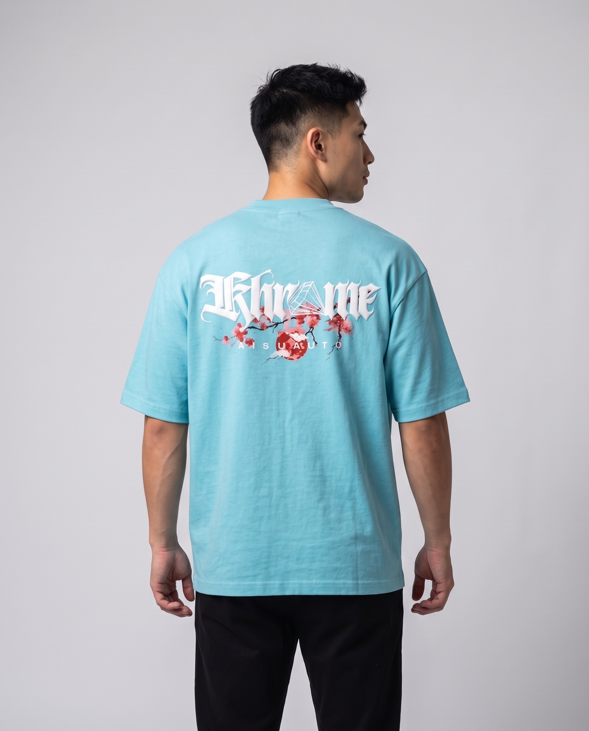 Tiffany Blue Kuromu Sakura T-Shirt by KHROME AISUAUTO worn by a model, back view showing the full back print