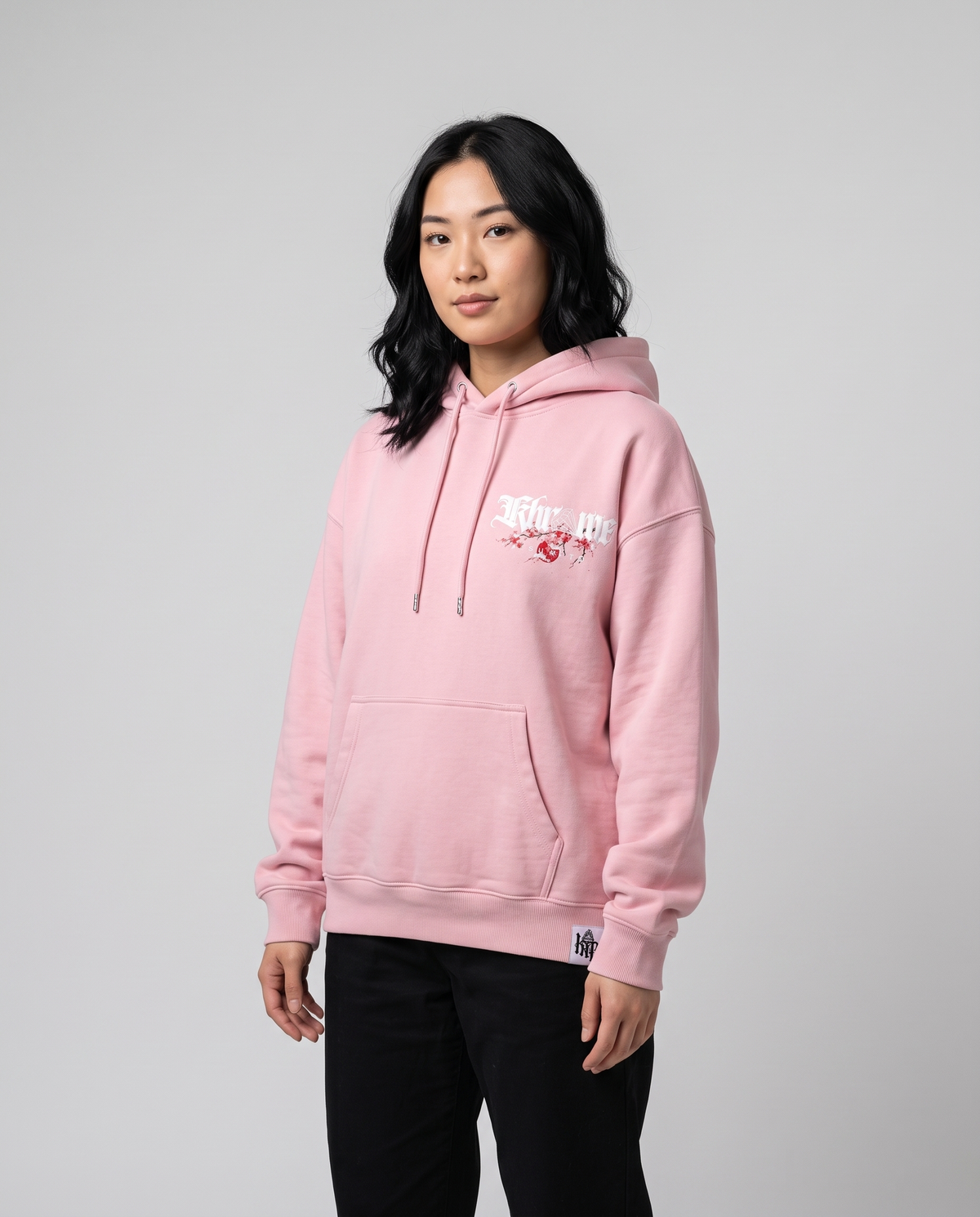 Baby Pink Kuromu Sakura Hoodie by KHROME AISUAUTO worn by a model, front view with chest logo