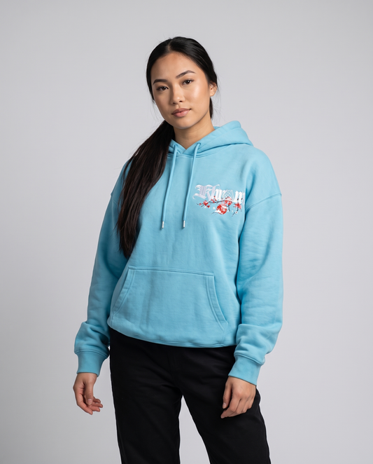 Tiffany Blue Kuromu Sakura Hoodie by KHROME AISUAUTO worn by a model, front view with chest logo