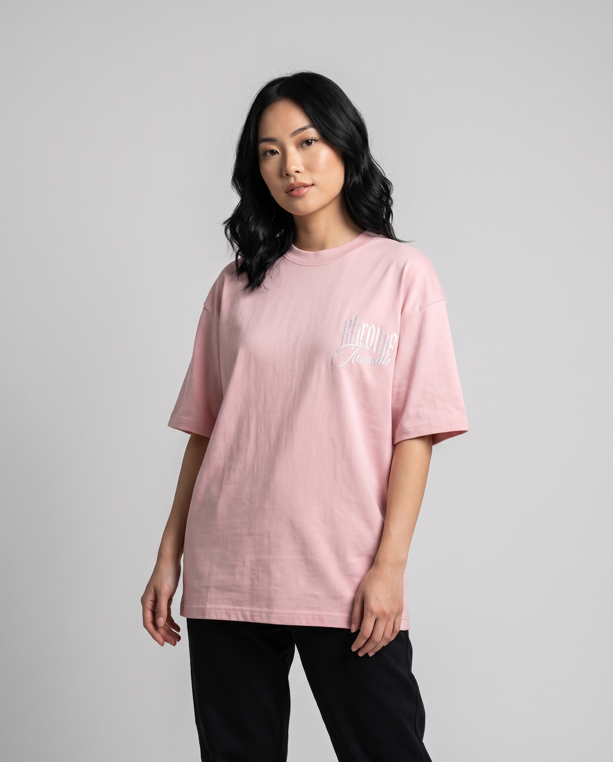 Pink Minimarisuto Sakura T-Shirt by KHROME AISUAUTO worn by a model, front view with chest logo