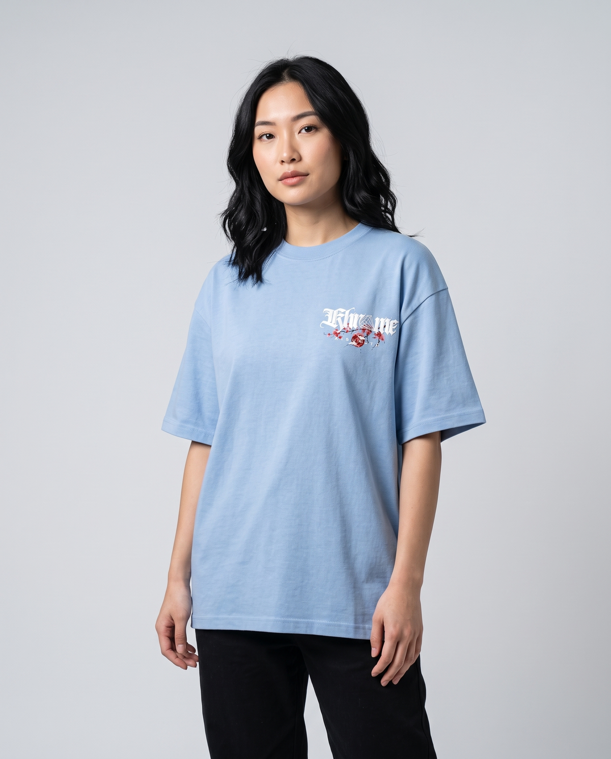 Baby Blue Kuromu Sakura T-Shirt by KHROME AISUAUTO worn by a model, front view with chest logo