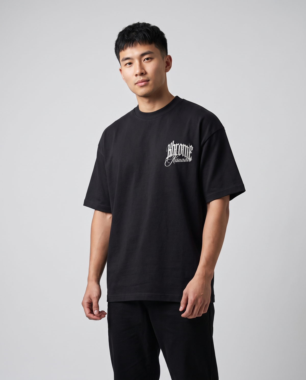 Black Minimarisuto Sakura T-Shirt by KHROME AISUAUTO worn by a model, front view with chest logo