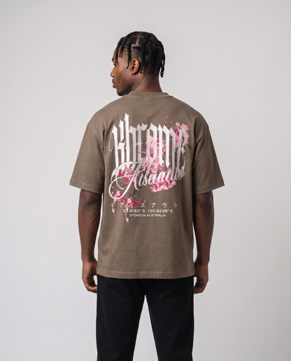 Walnut Minimarisuto Sakura T-Shirt by KHROME AISUAUTO worn by a model, back view showing the full back print