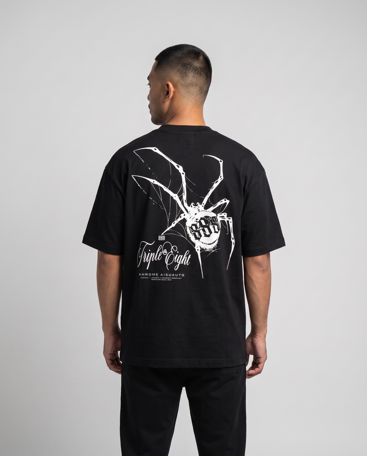 Black Dakusukai Spider T-Shirt by KHROME AISUAUTO worn by a model, back view showing the full back print