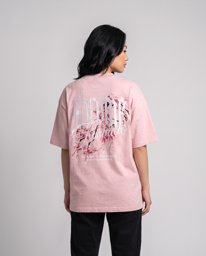 Pink Minimarisuto Sakura T-Shirt by KHROME AISUAUTO worn by a model, back view showing the full back print