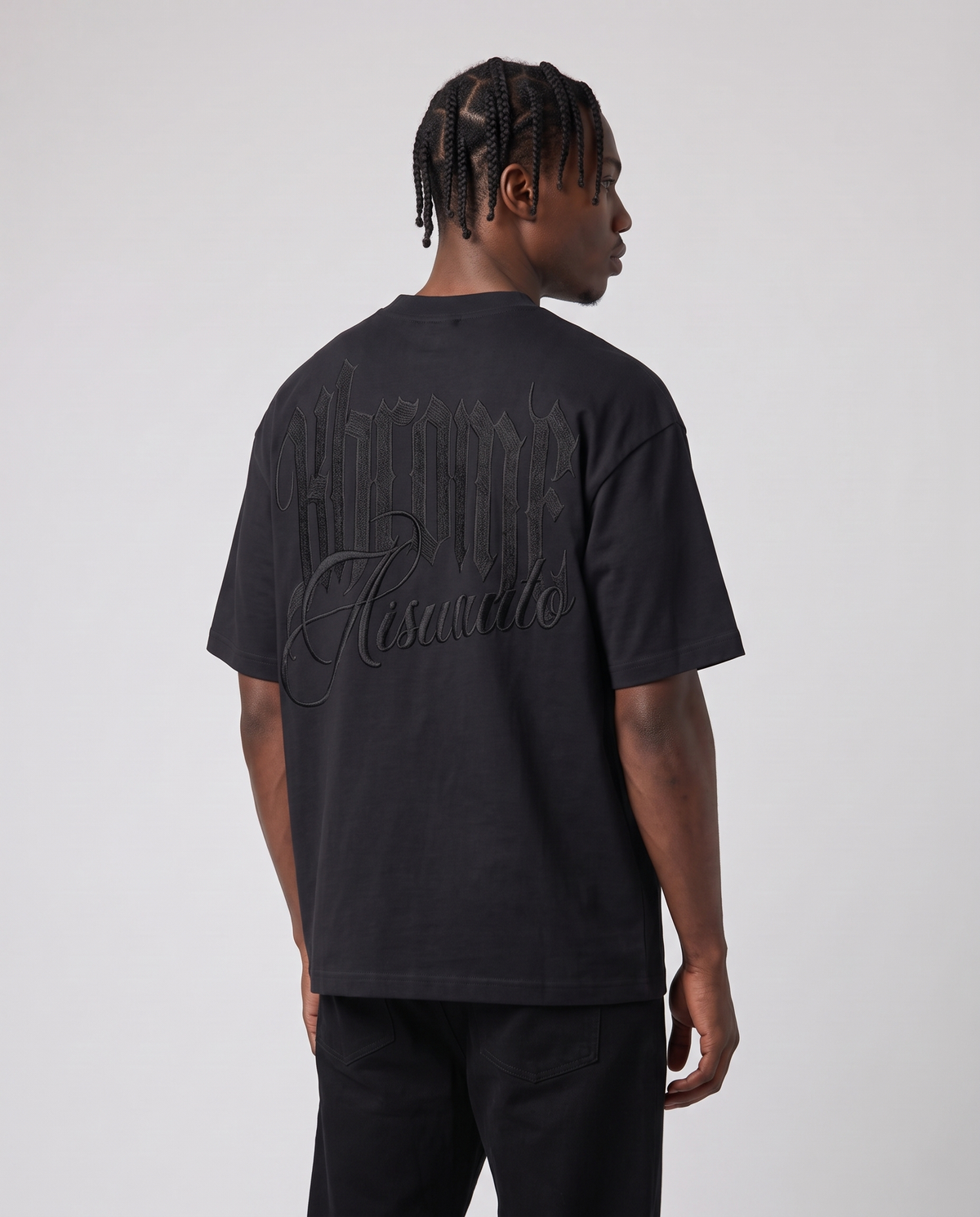 Black Minimarisuto T-Shirt Black On Black by KHROME AISUAUTO worn by a model, back view showing the full back print