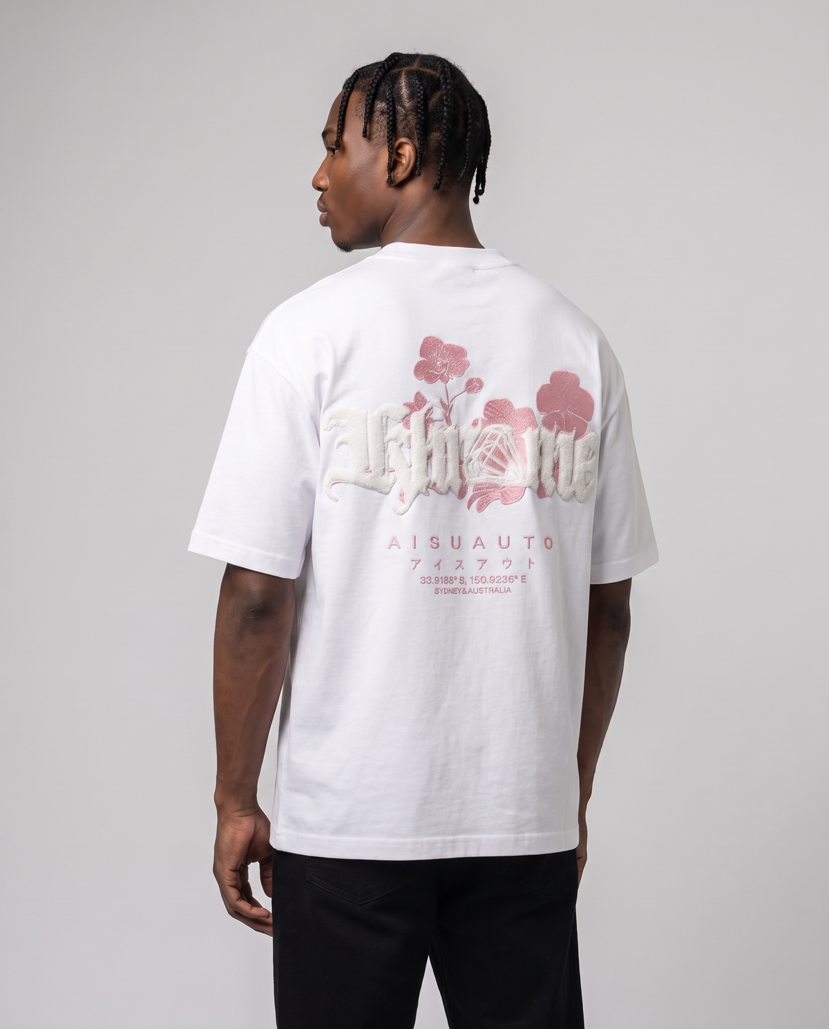 White Sakurasheniru Blossom T-Shirt by KHROME AISUAUTO worn by a model, back view showing the full back print