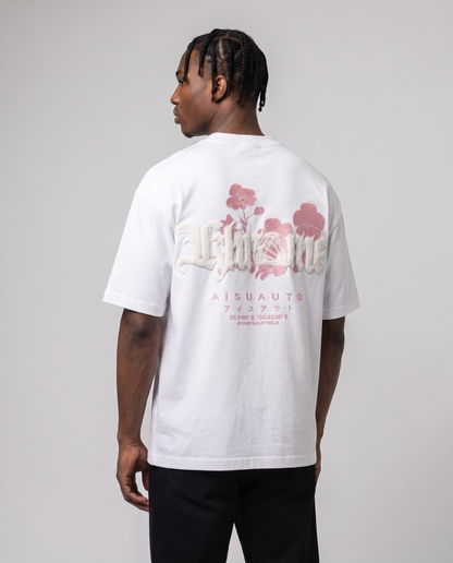 White Sakurasheniru Blossom T-Shirt by KHROME AISUAUTO worn by a model, back view showing the full back print