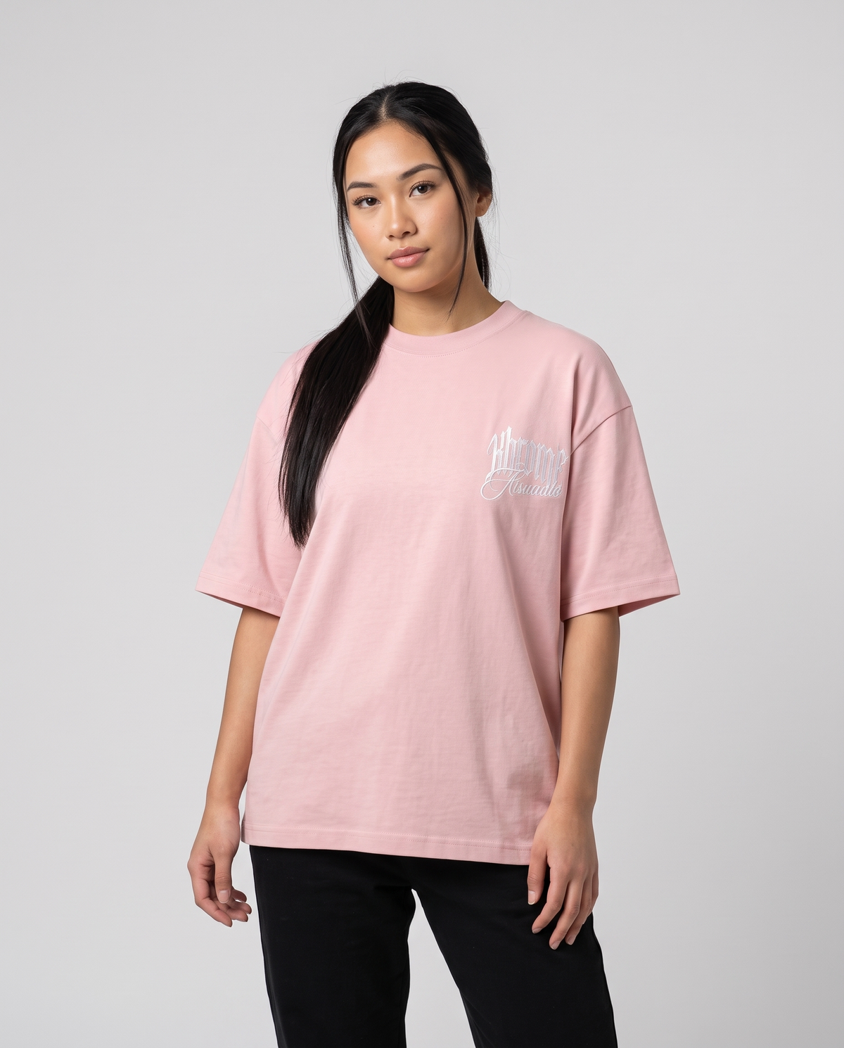 Pink Minimarisuto T-Shirt by KHROME AISUAUTO worn by a model, front view with chest logo