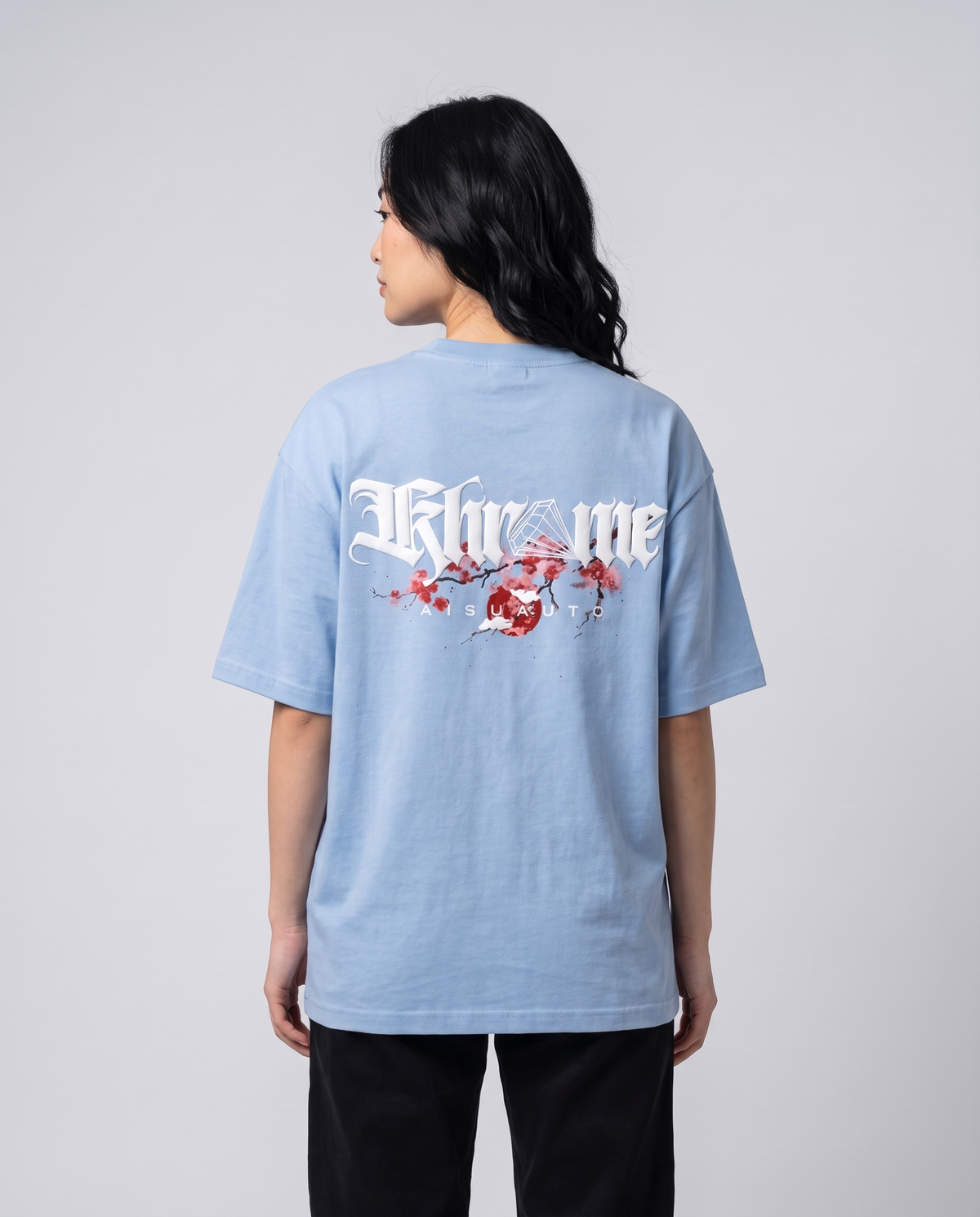 Baby Blue Kuromu Sakura T-Shirt by KHROME AISUAUTO worn by a model, back view showing the full back print
