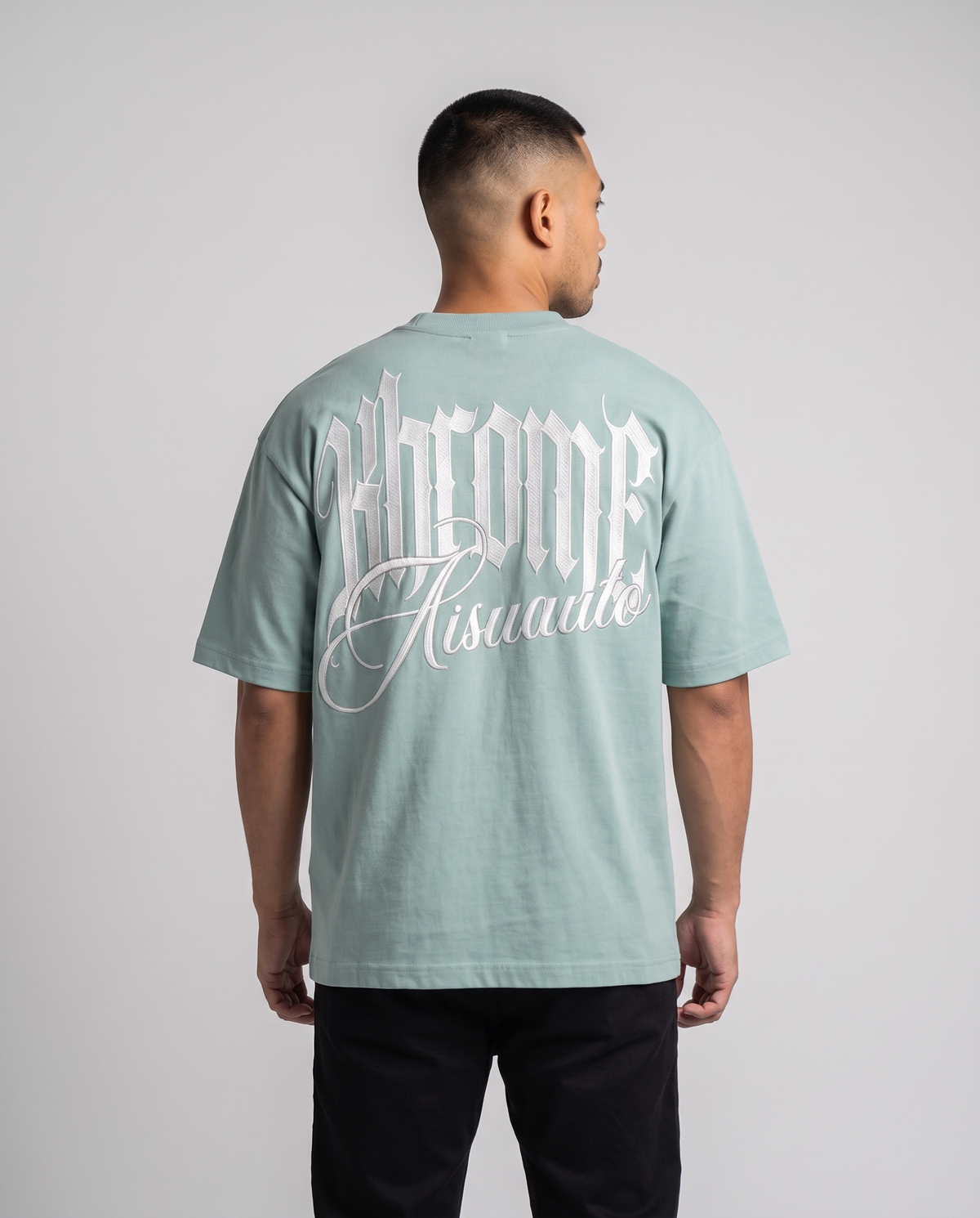 Teal Minimarisuto T-Shirt by KHROME AISUAUTO worn by a model, back view showing the full back print
