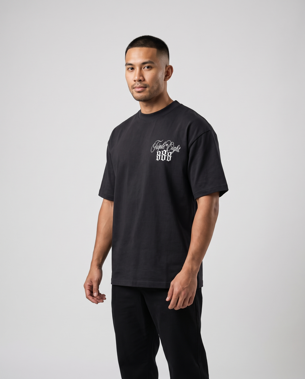 Black Triple Eight T-Shirt by KHROME AISUAUTO worn by a model, front view with chest logo