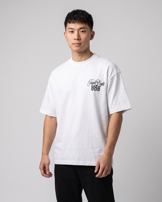 White Triple Eight T-Shirt by KHROME AISUAUTO worn by a model, front view with chest logo