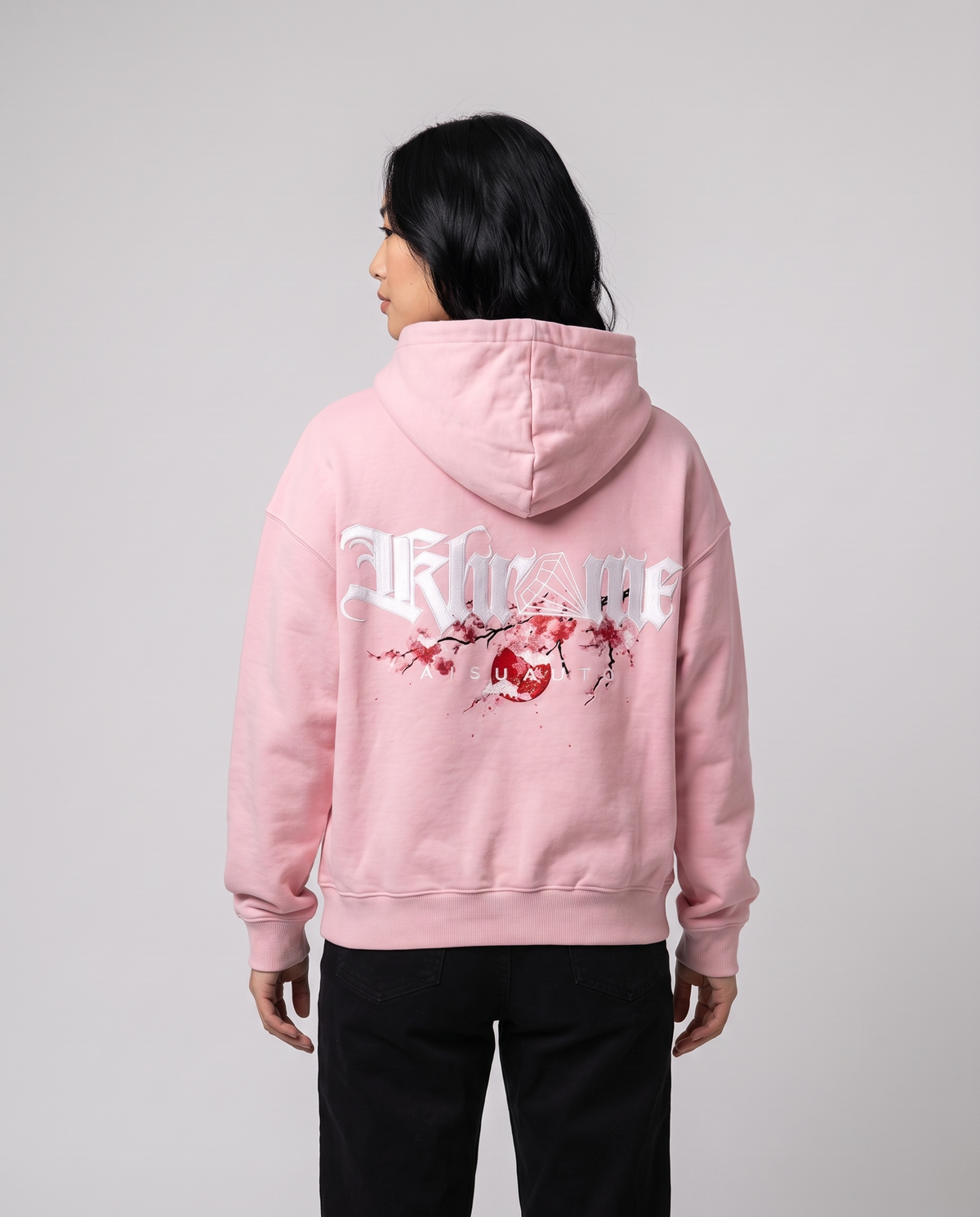 Baby Pink Kuromu Sakura Hoodie by KHROME AISUAUTO worn by a model, back view showing the full back print