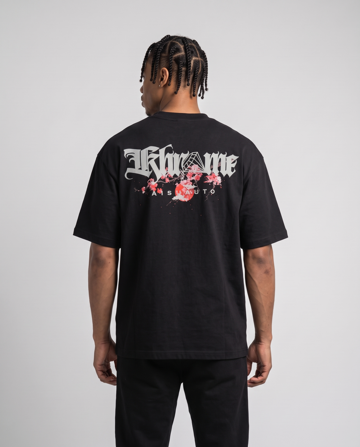 Black Kuromu Sakura T-Shirt by KHROME AISUAUTO worn by a model, back view showing the full back print