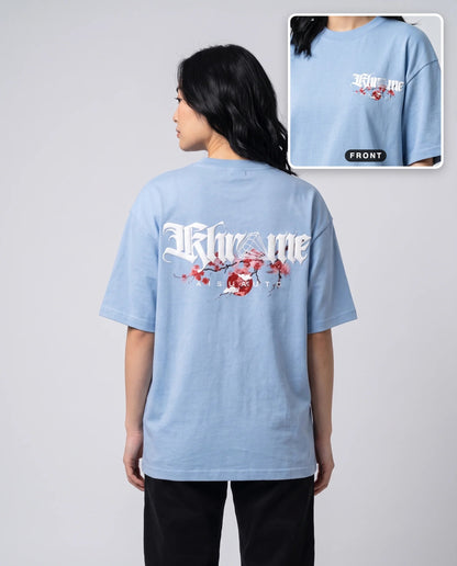 Baby Blue Kuromu Sakura T-Shirt by KHROME AISUAUTO worn by a model, back print with front chest logo detail
