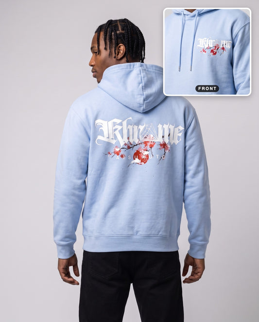 Baby Blue Kuromu Sakura Hoodie by KHROME AISUAUTO worn by a model, back print with front chest logo detail
